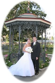 Couple standing in front of a gazebo
